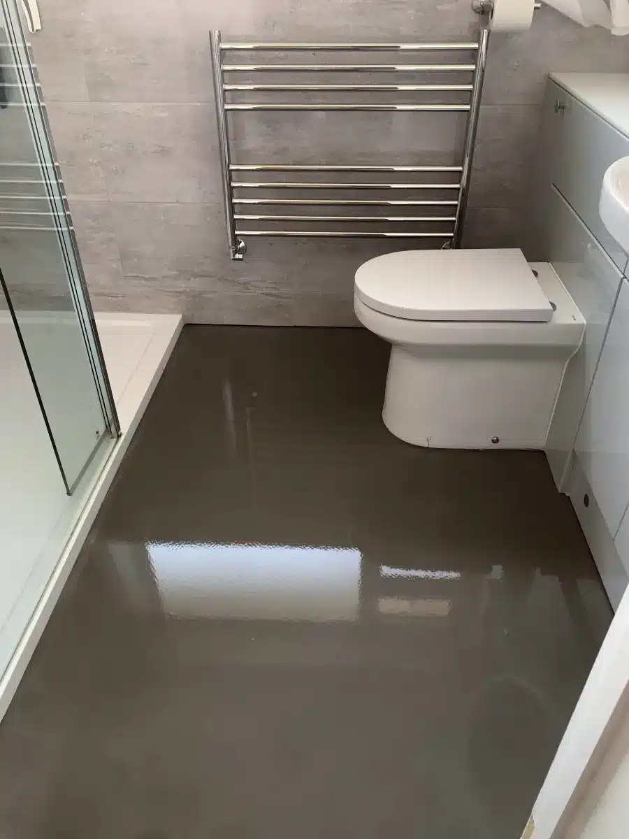 How Much Should New Flooring Cost in the UK? (2026 Price Guide) | Grimley Flooring Ltd A smoothing compound applied to a bathroom